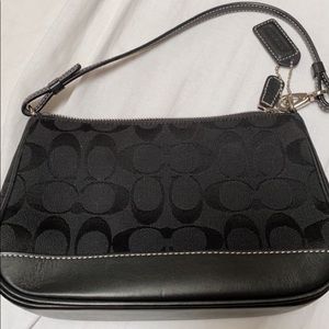 Designer Coach handbag, barely used, kept clean, has the tag as well. All black.
